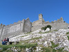 Costello-Events > The "Rock of Cashel" from the approach.  This stone outcrop soars 200 feet above the green plain of the Tipperary countryside.  One can easily see why it was a defensive fortress of kings for centuries.